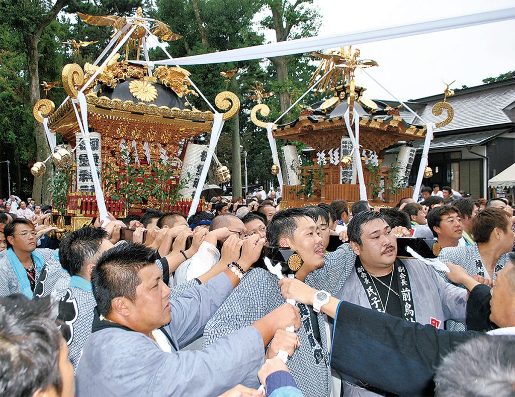 People carring 神輿(protable shrine) at 祭 (festival)